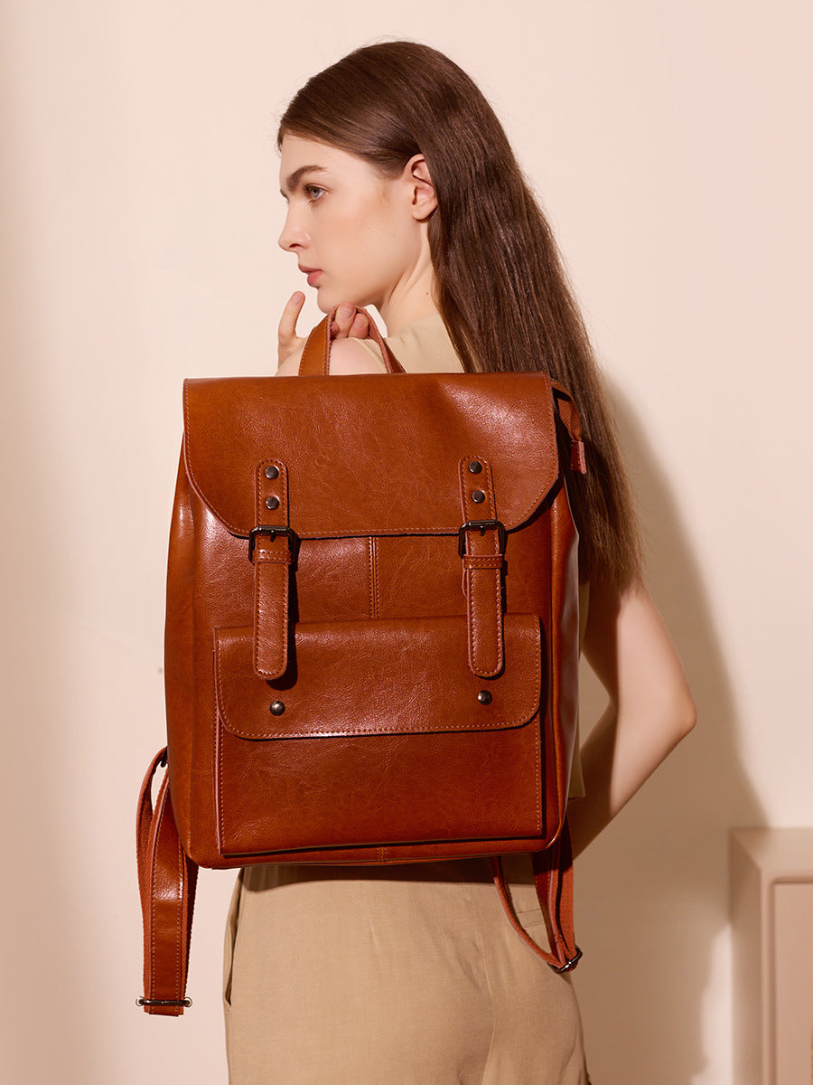 Vintage Rucksack aus braunem Leder mit Fronttasche und Schnallenriemen