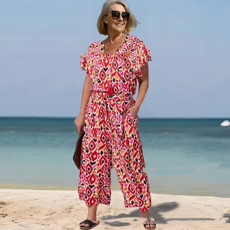 Vibrant Printed V-Neck Jumpsuit by Greta 
