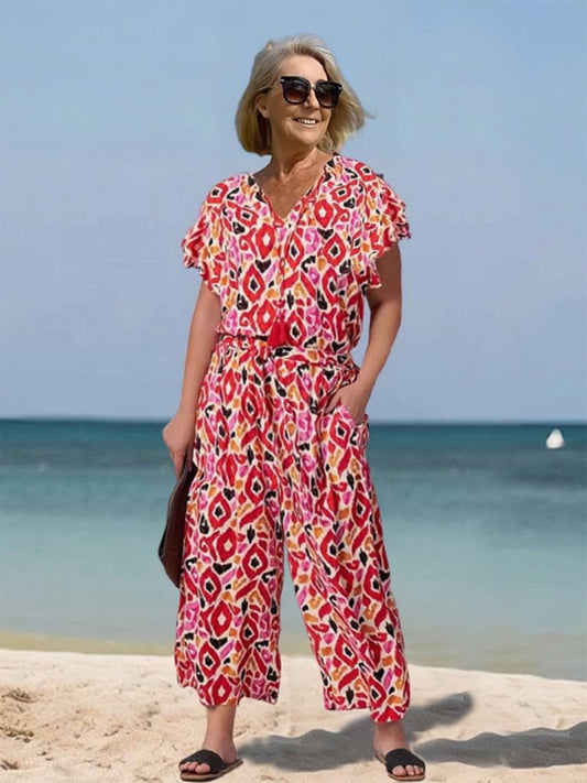 Vibrant Printed V-Neck Jumpsuit by Greta 